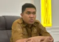 Kepala Dinas Komunikasi, Informatika, Persandian dan Statistik (Diskominfosantik) Provinsi Sulteng Wahyu Agus Pratama, ketika dimintai keterangan mengenai program Berani Berdering, Selasa (25/8/2026). (Lingkar.news Network)
